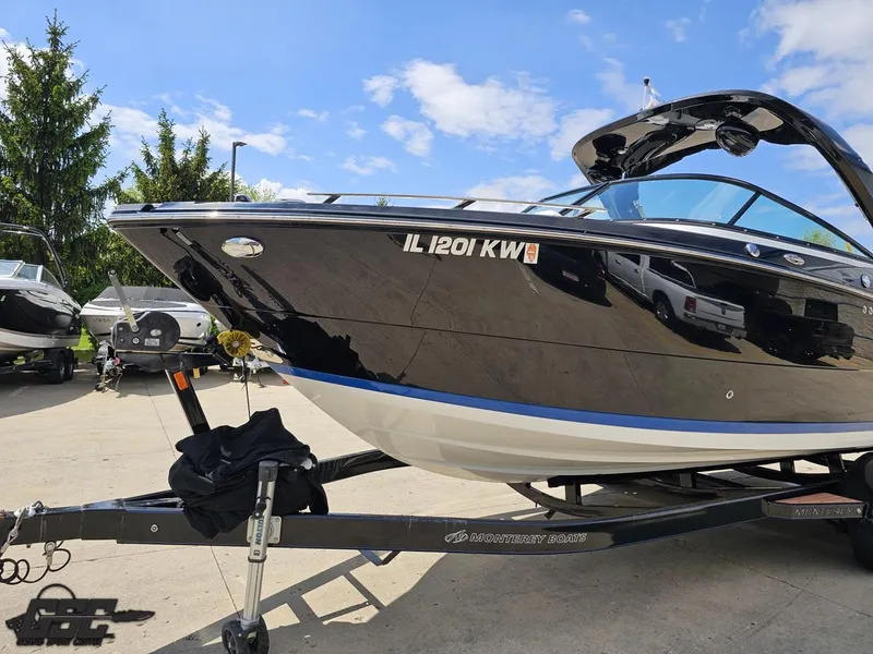 Slide: The Image of 2018 Monterey 258 Super Sport boat on trailer under blue sky. - 12