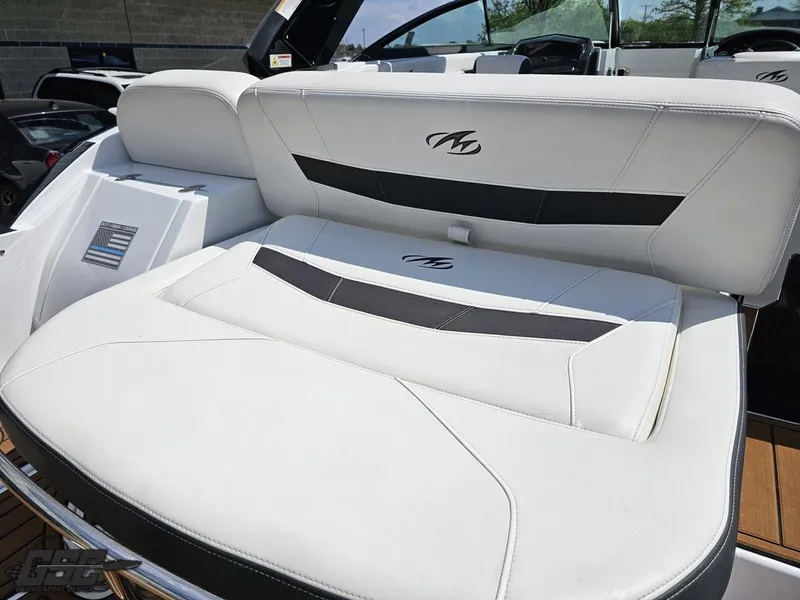 Slide: The Image of 2018 Monterey 258 Super Sport boat with white and black seating. - 25