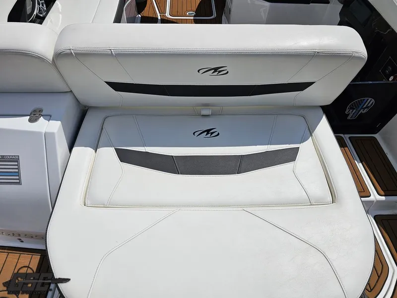 Slide: The Image of 2018 Monterey 258 Super Sport boat with white cushioned seating and sleek design. - 27