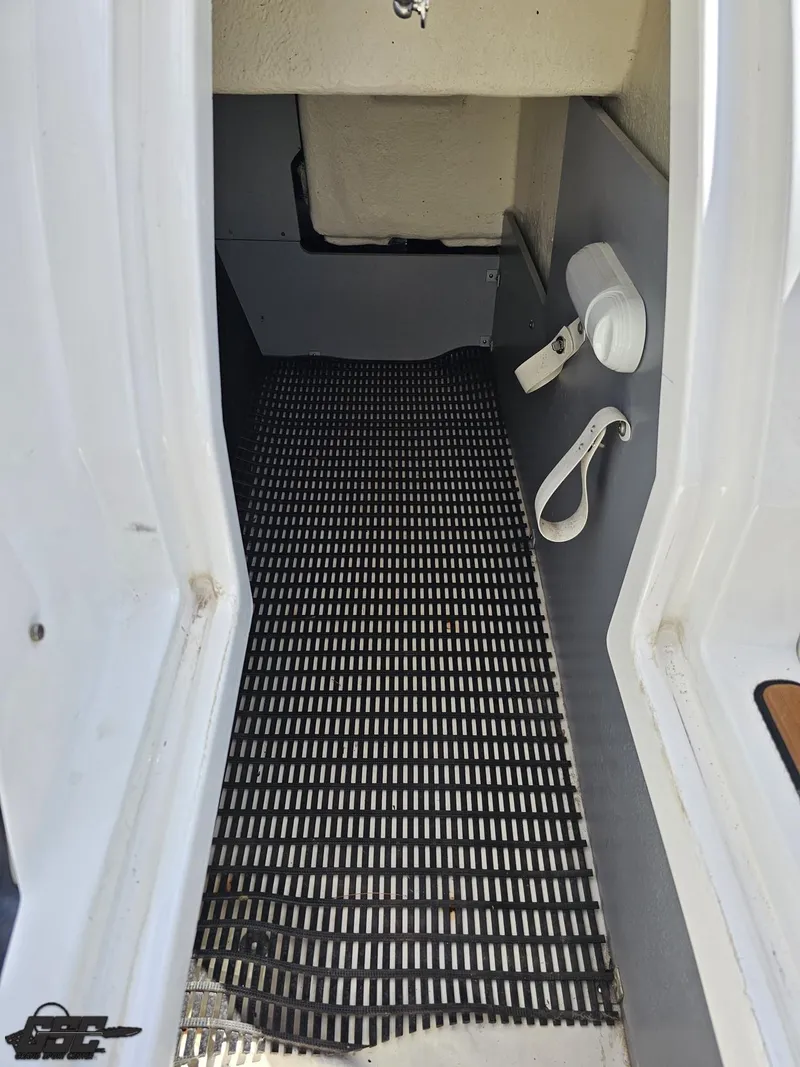 Slide: The Image of 2018 Monterey 258 Super Sport interior with non-slip flooring and storage features. - 28