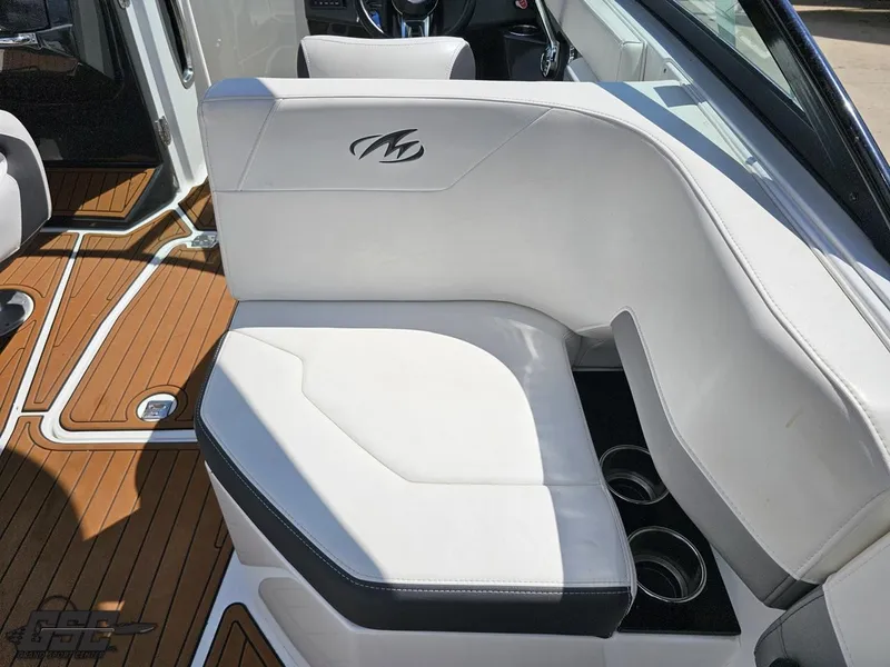 Slide: The Image of 2018 Monterey 258 Super Sport boat interior with white seating and wood flooring. - 37