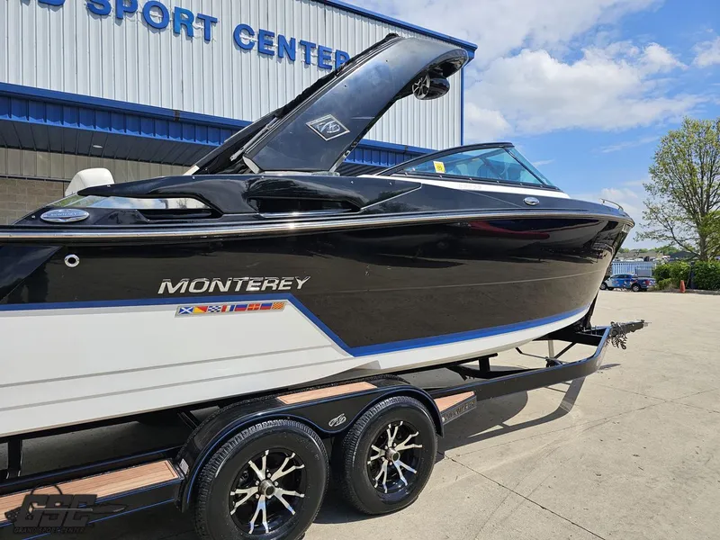 Slide: The Image of 2018 Monterey 258 Super Sport boat on trailer outside sports center. - 4