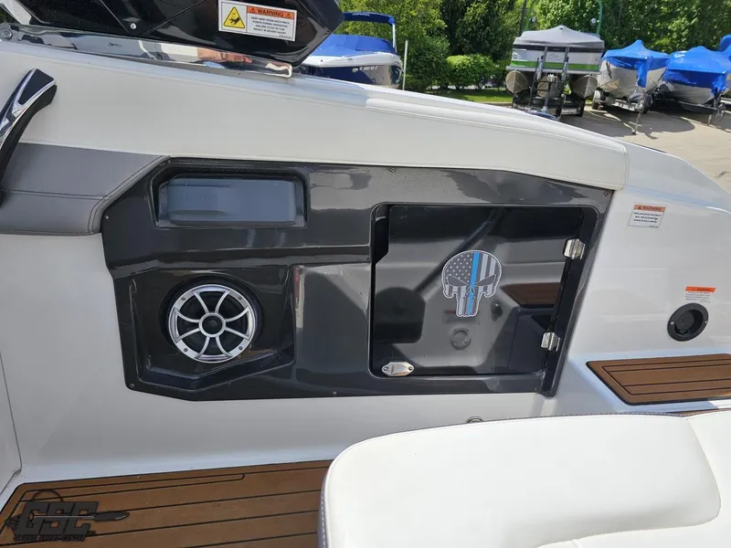 Slide: The Image of 2018 Monterey 258 Super Sport boat interior with speaker and storage compartment. - 42