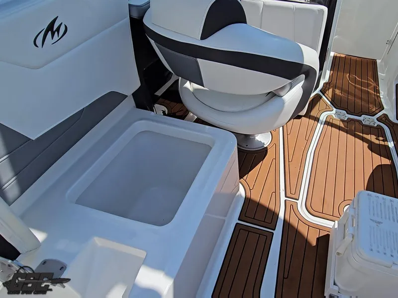 Slide: The Image of 2018 Monterey 258 Super Sport boat interior with seating and wood-style flooring. - 47