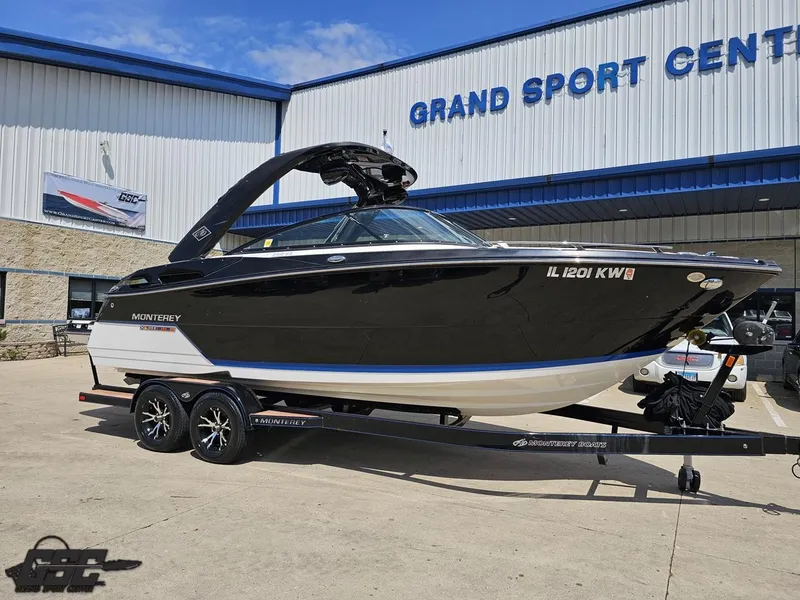 Slide: The Image of 2018 Monterey 258 Super Sport boat on trailer outside Grand Sport Center. - 9