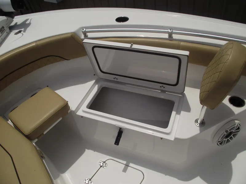 Slide: The Image of 2021 Sportsman Open 212 Center Console boat interior with storage compartment and seating. - 13