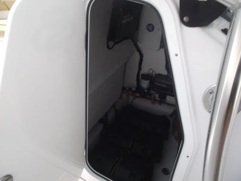 Slide: The Image of 2021 Sportsman Open 212 Center Console interior storage compartment. - 23