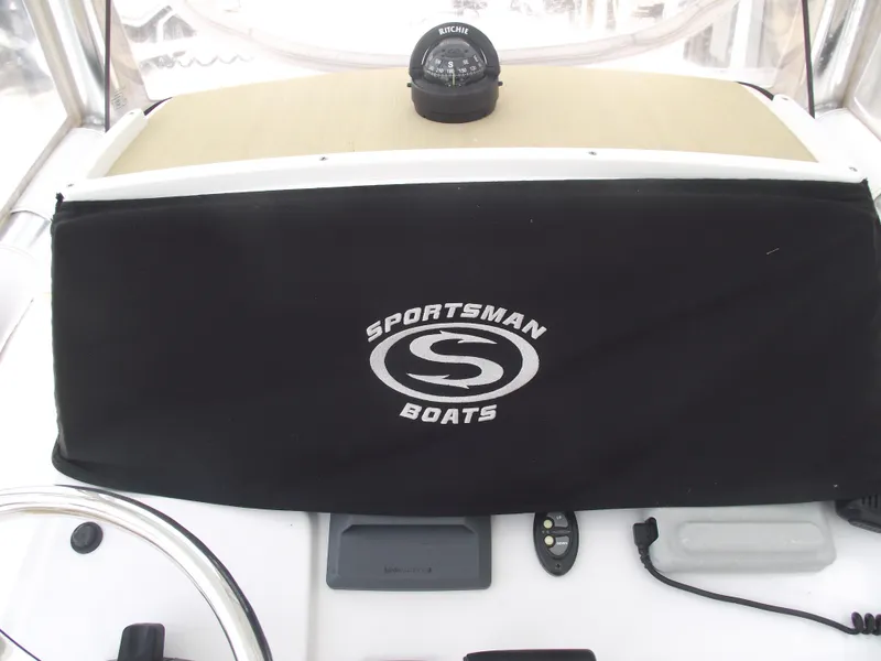 Slide: The Image of 2021 Sportsman Open 212 Center Console dashboard with compass and branded cover. - 26
