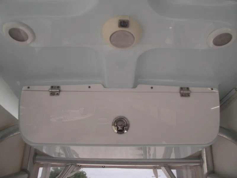 Slide: The Image of 2021 Sportsman Open 212 Center Console boat interior ceiling with storage compartment. - 32