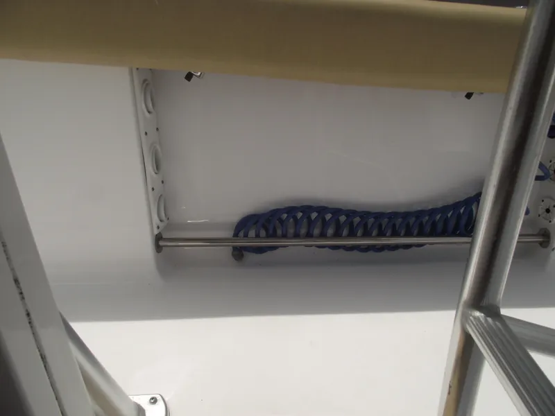 Slide: The Image of 2021 Sportsman Open 212 Center Console interior detail with coiled blue rope. - 36