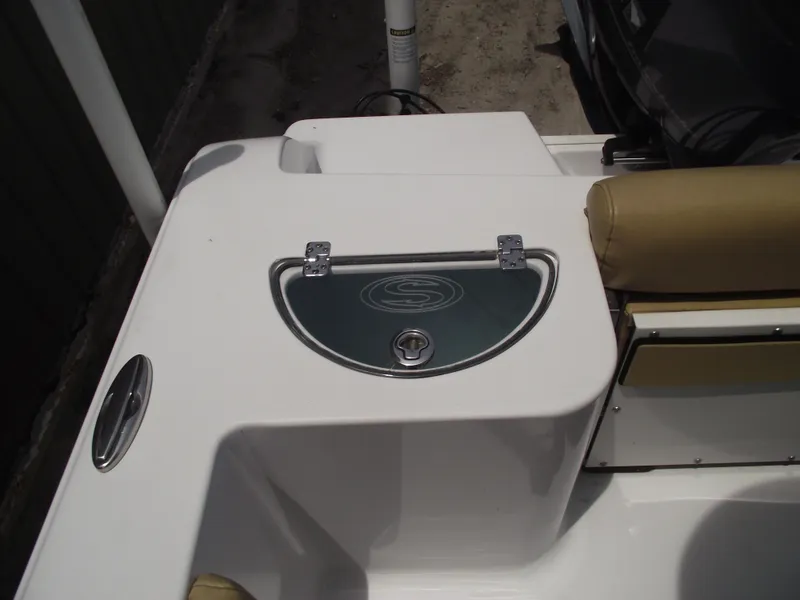 Slide: The Image of 2021 Sportsman Open 212 Center Console boat detail with storage compartment and seating. - 39