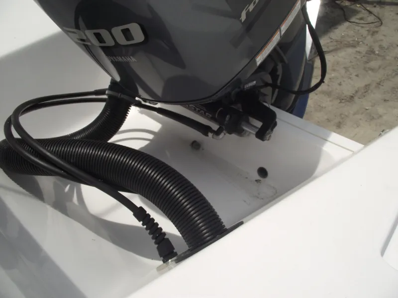 Slide: The Image of 2021 Sportsman Open 212 Center Console boat engine detail with cables. - 43