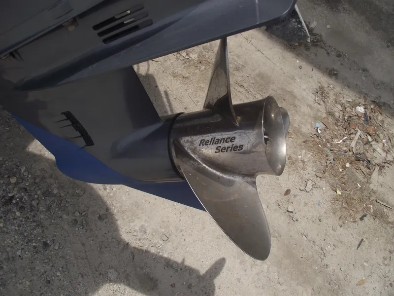 Slide: The Image of Propeller of 2021 Sportsman Open 212 Center Console, Reliance Series, on sandy ground. - 5