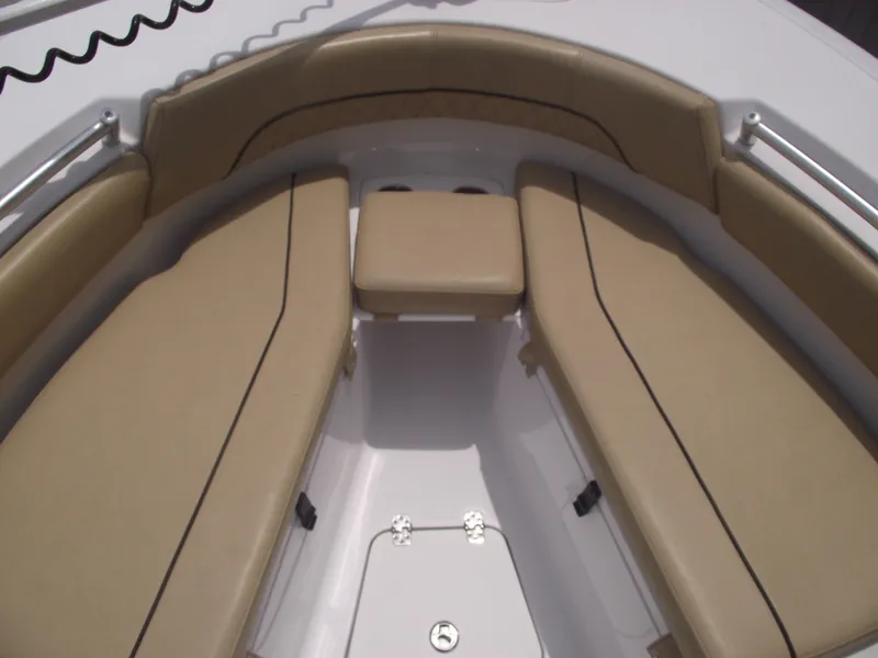 Slide: The Image of 2021 Sportsman Open 212 Center Console boat with tan cushioned seating. - 7