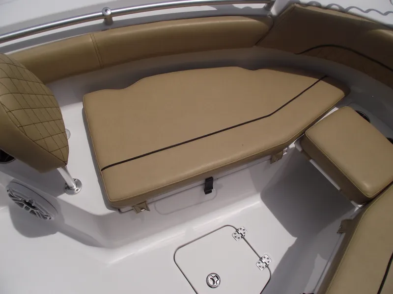 Slide: The Image of 2021 Sportsman Open 212 Center Console boat with tan cushioned seating. - 8