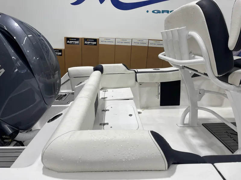 Slide: The Image of 2025 Tidewater 210LXF boat interior with seating and engine, showcasing modern design. - 11