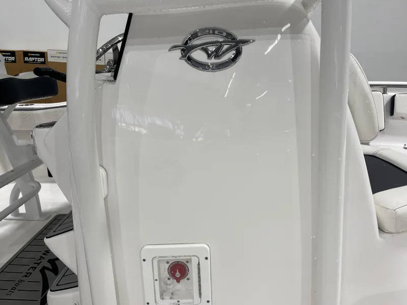 Slide: The Image of 2025 Tidewater 210LXF boat interior with logo and seating detail. - 13