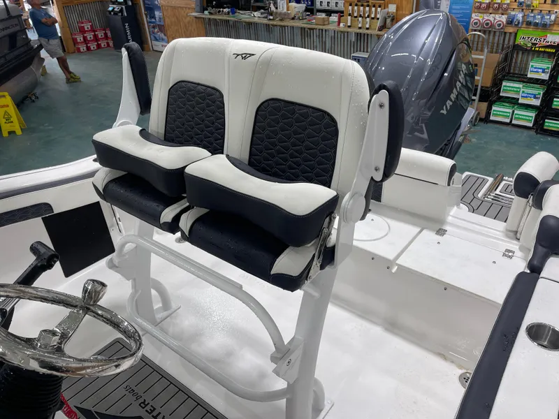 Slide: The Image of 2025 Tidewater 210LXF boat interior with dual seats and Yamaha engine. - 18