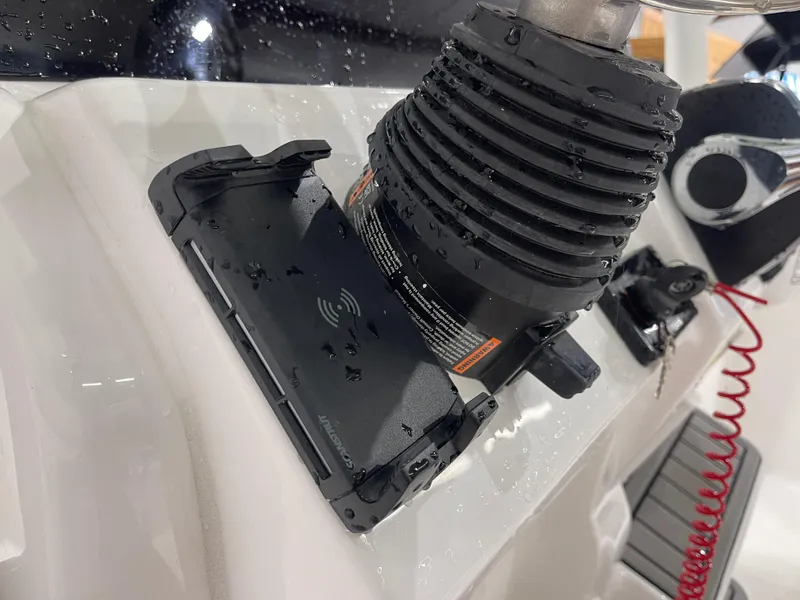 Slide: The Image of Wet console area of 2025 Tidewater 210LXF boat with steering and controls. - 24