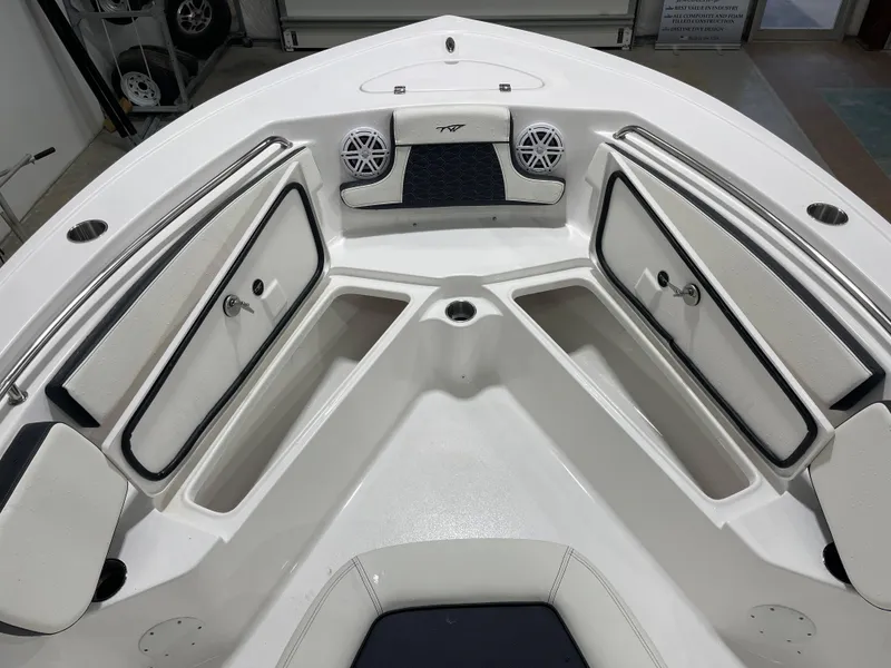 Slide: The Image of 2025 Tidewater 210LXF boat interior with storage compartments and speakers. - 30