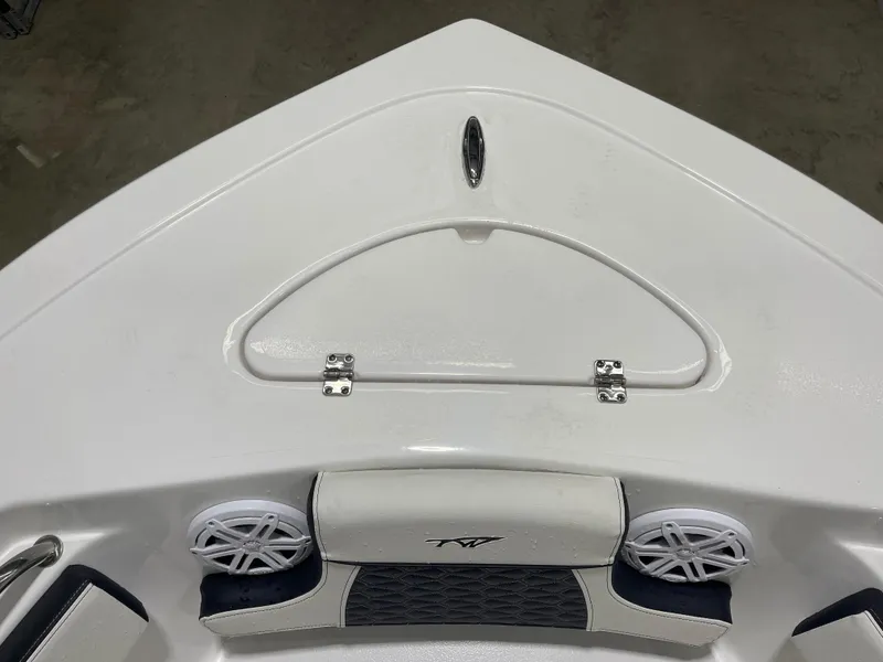 Slide: The Image of 2025 Tidewater 210LXF boat bow with storage hatch and speakers. - 31