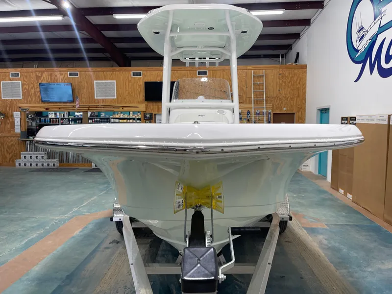 Slide: The Image of 2025 Tidewater 210LXF boat displayed indoors, showcasing sleek design and modern features. - 5