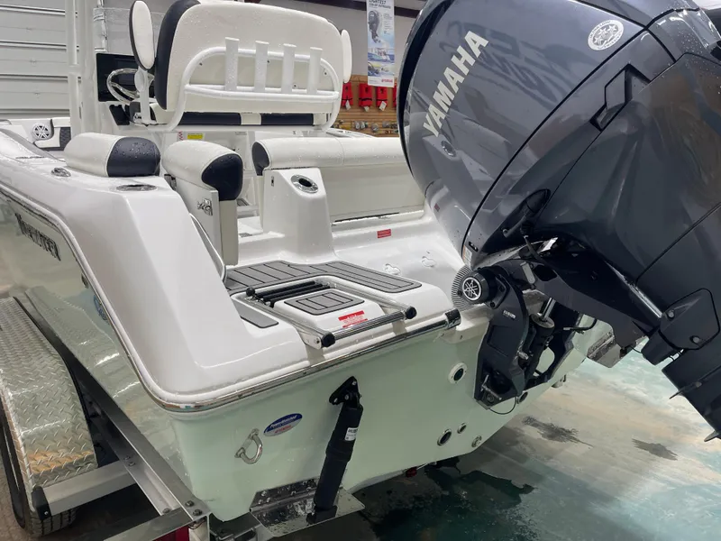 Slide: The Image of 2025 Tidewater 210LXF boat with Yamaha engine, rear view in showroom. - 8