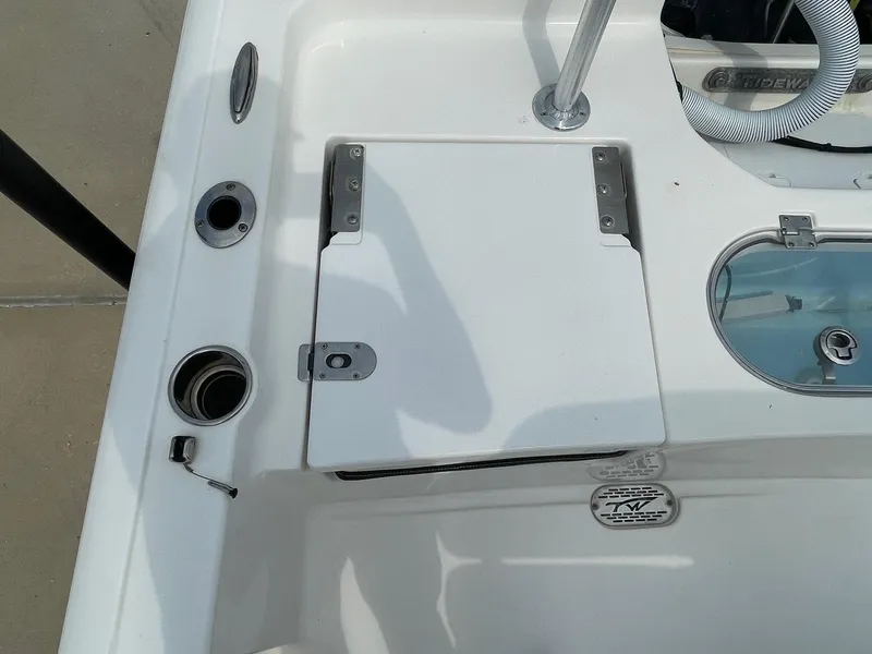 Slide: The Image of 2022 Tidewater 2110BM boat deck with storage compartment and fittings. - 11