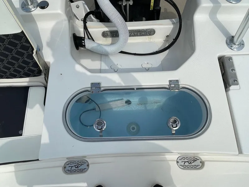Slide: The Image of 2022 Tidewater 2110BM boat livewell with clear lid and fittings. - 13