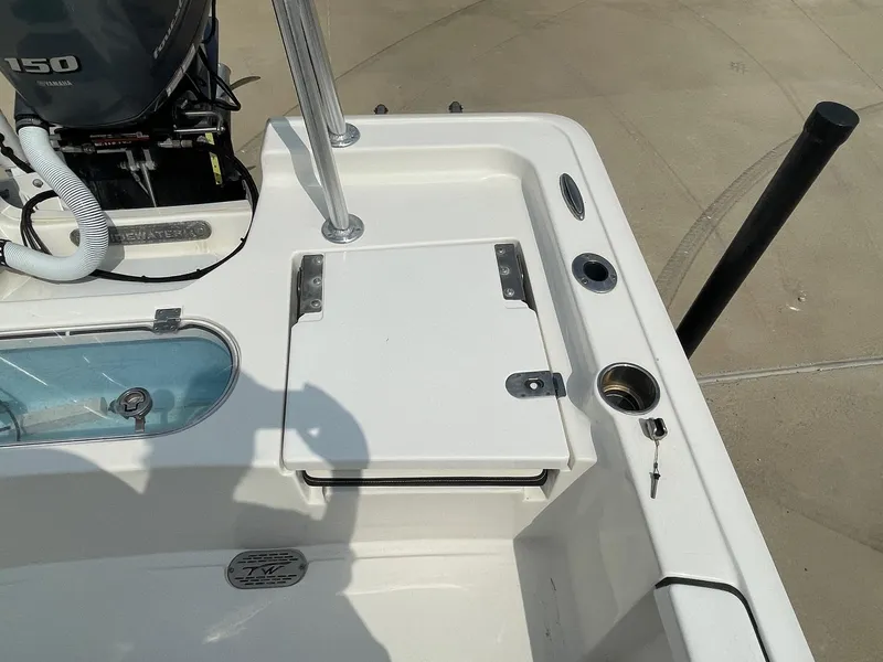 Slide: The Image of 2022 Tidewater 2110BM boat deck with Yamaha engine and storage compartments. - 15