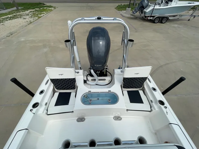 Slide: The Image of 2022 Tidewater 2110BM boat with motor, seating, and storage compartments. - 18
