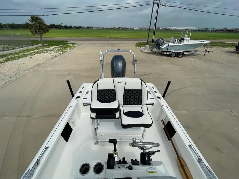 Slide: The Image of 2022 Tidewater 2110BM boat interior with dual seats and steering console. - 20