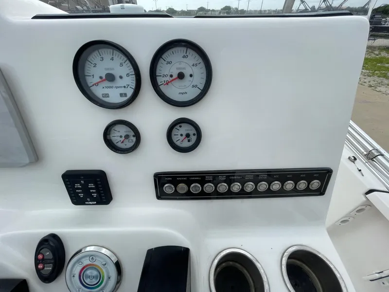 Slide: The Image of 2022 Tidewater 2110BM boat dashboard with gauges and control panel. - 22