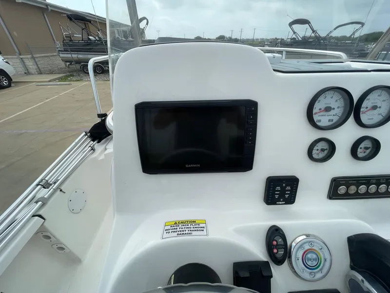 Slide: The Image of 2022 Tidewater 2110BM boat dashboard with Garmin display and gauges. - 24