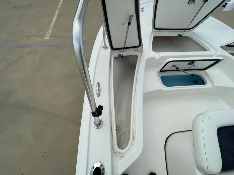 Slide: The Image of 2022 Tidewater 2110BM boat deck with open storage compartments. - 31