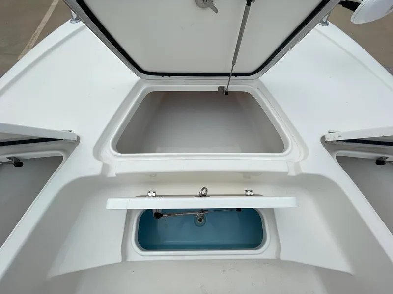Slide: The Image of 2022 Tidewater 2110BM boat storage compartments and livewell, open and ready for use. - 32