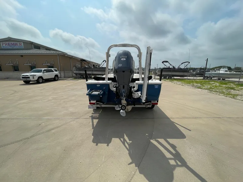 Slide: The Image of 2022 Tidewater 2110BM boat with outboard motor in a parking lot. - 8