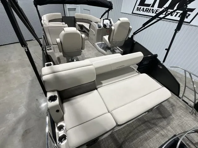 Slide: The Image of 2022 Harris SUNLINER 230 SLDH pontoon boat with spacious seating and modern interior design. - 11