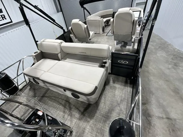 Slide: The Image of 2022 Harris SUNLINER 230 SLDH pontoon boat interior with plush seating and modern design. - 12