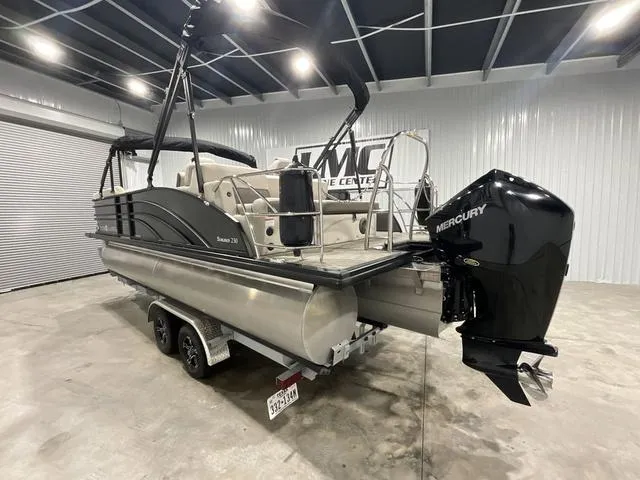 Slide: The Image of 2022 Harris SUNLINER 230 SLDH pontoon boat with Mercury engine in showroom. - 4