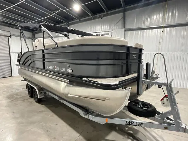 Slide: The Image of 2022 Harris SUNLINER 230 SLDH pontoon boat on trailer in indoor storage. - 6