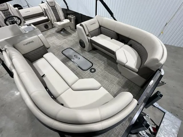 Slide: The Image of 2022 Harris SUNLINER 230 SLDH pontoon boat interior with plush seating and modern design. - 7