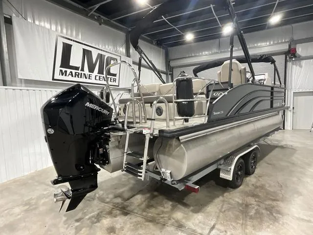 Slide: The Image of 2022 Harris SUNLINER 230 SLDH pontoon boat in showroom with Mercury outboard. - 8