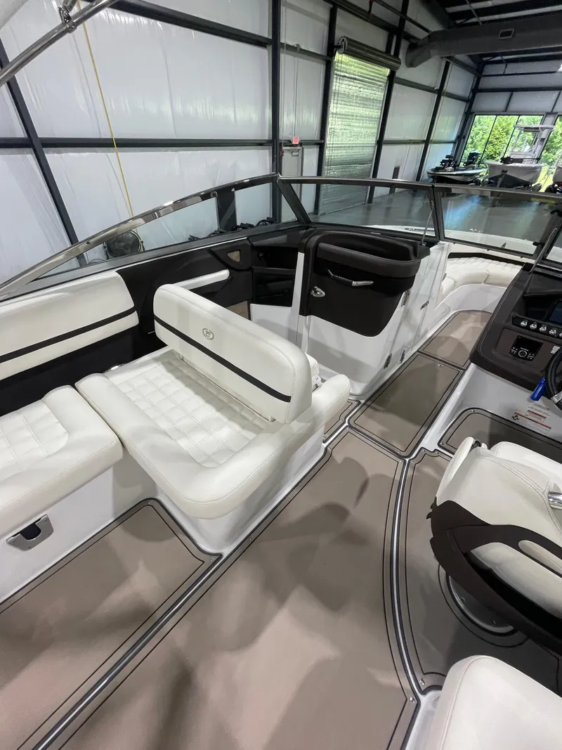 Slide: The Image of Interior of a 2018 Cobalt R5 boat with white seating and modern design. - 10