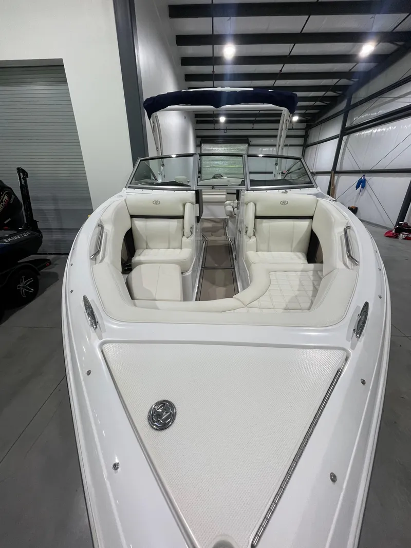 Slide: The Image of 2018 Cobalt R5 boat with white interior, docked indoors. - 11
