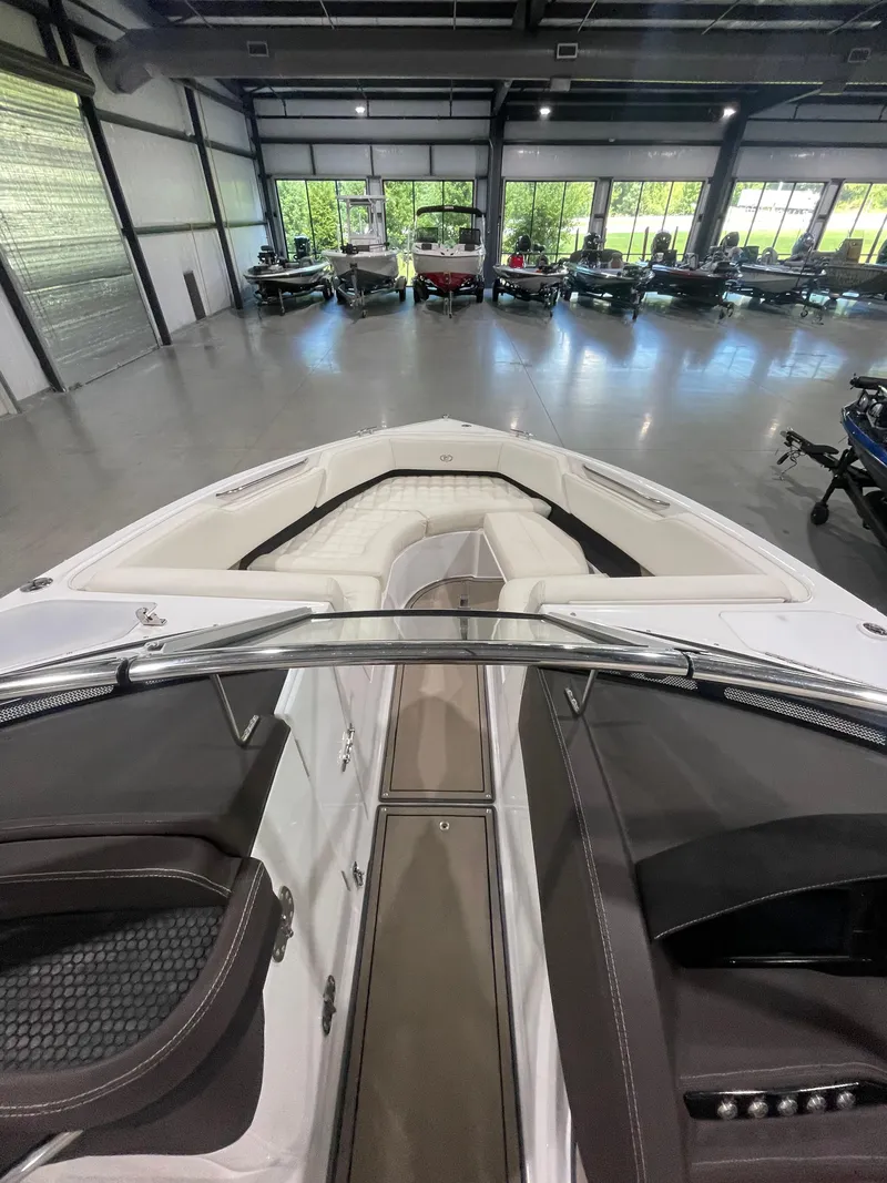 Slide: The Image of 2018 Cobalt R5 boat interior in showroom, featuring sleek design and comfortable seating. - 18
