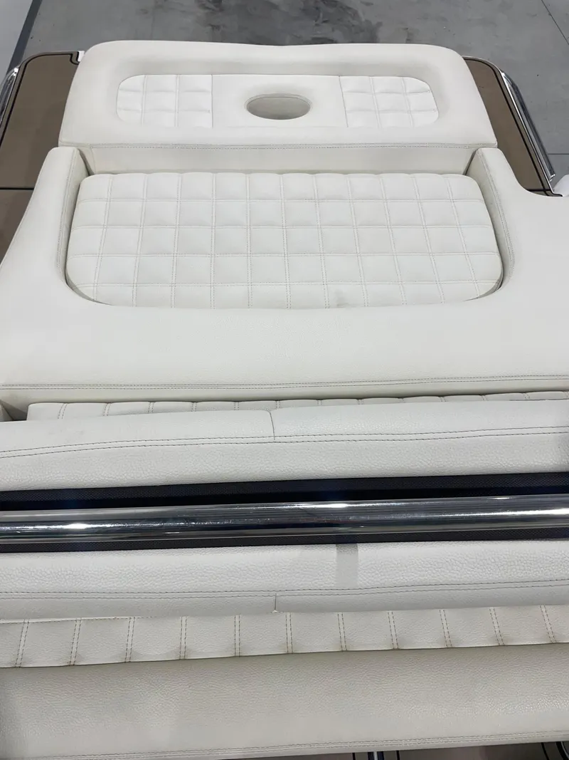 Slide: The Image of White leather seating on 2018 Cobalt R5 boat, featuring quilted design and cup holder. - 21