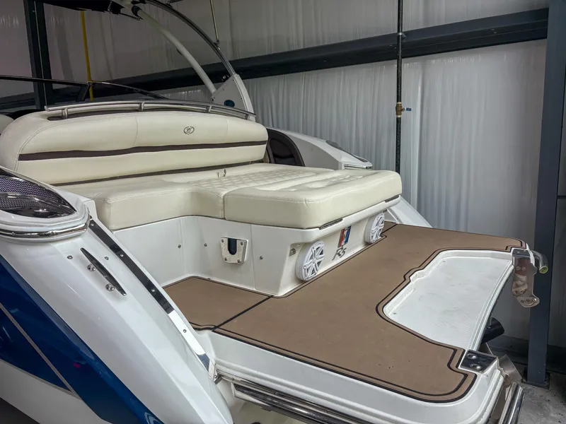 Slide: The Image of 2018 Cobalt R5 boat interior with cushioned seating and swim platform in storage. - 4