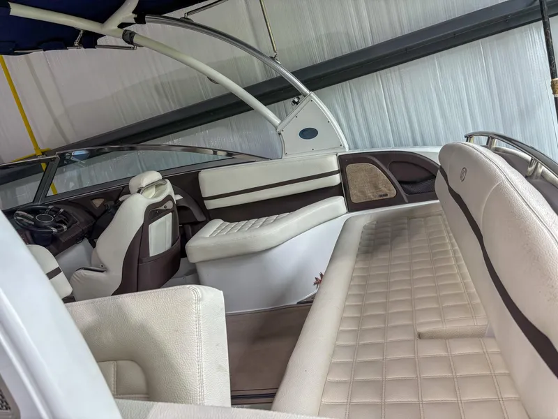 Slide: The Image of 2018 Cobalt R5 boat interior with white leather seating and modern design. - 5