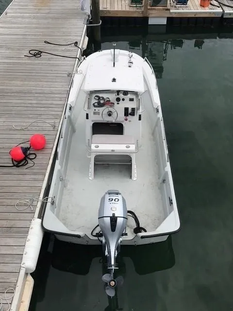 Slide: The Image of 2000 Maritime Skiff 2090 docked with outboard motor, viewed from above. - 4
